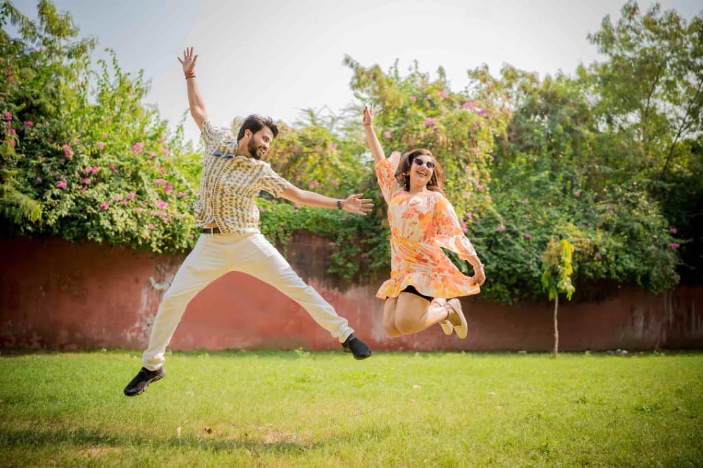 Candid moment of a couple laughing during their wedding celebration