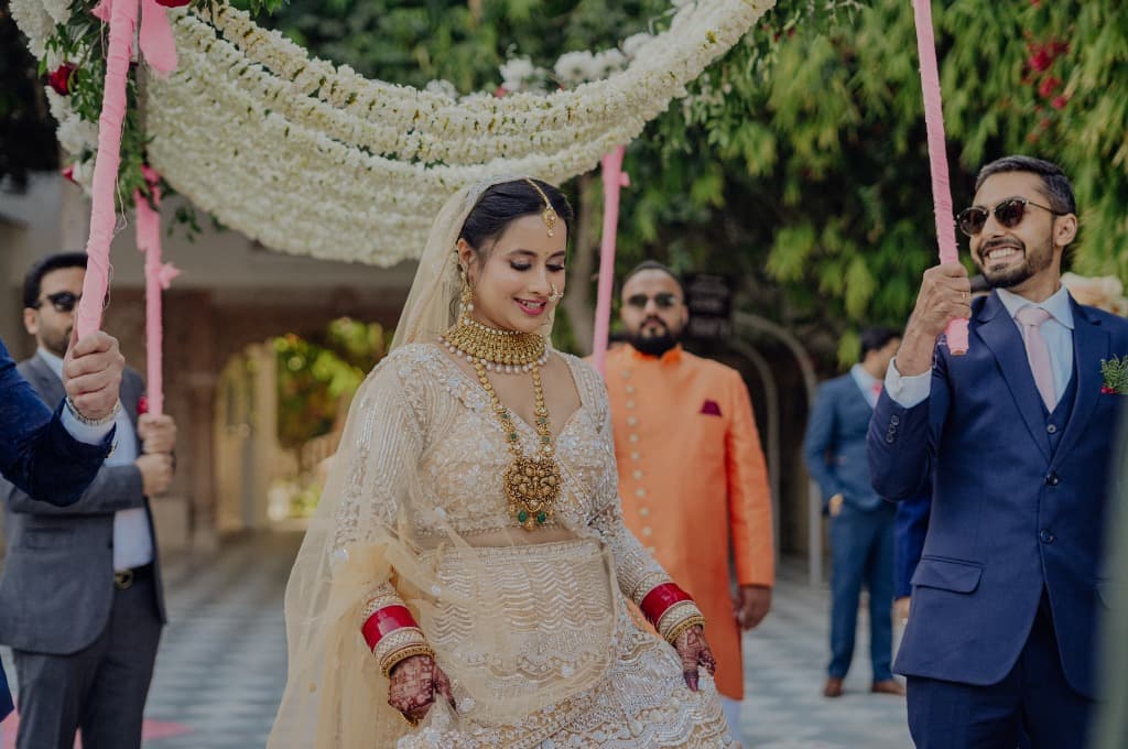 Wedding Couple under Floral Canopy