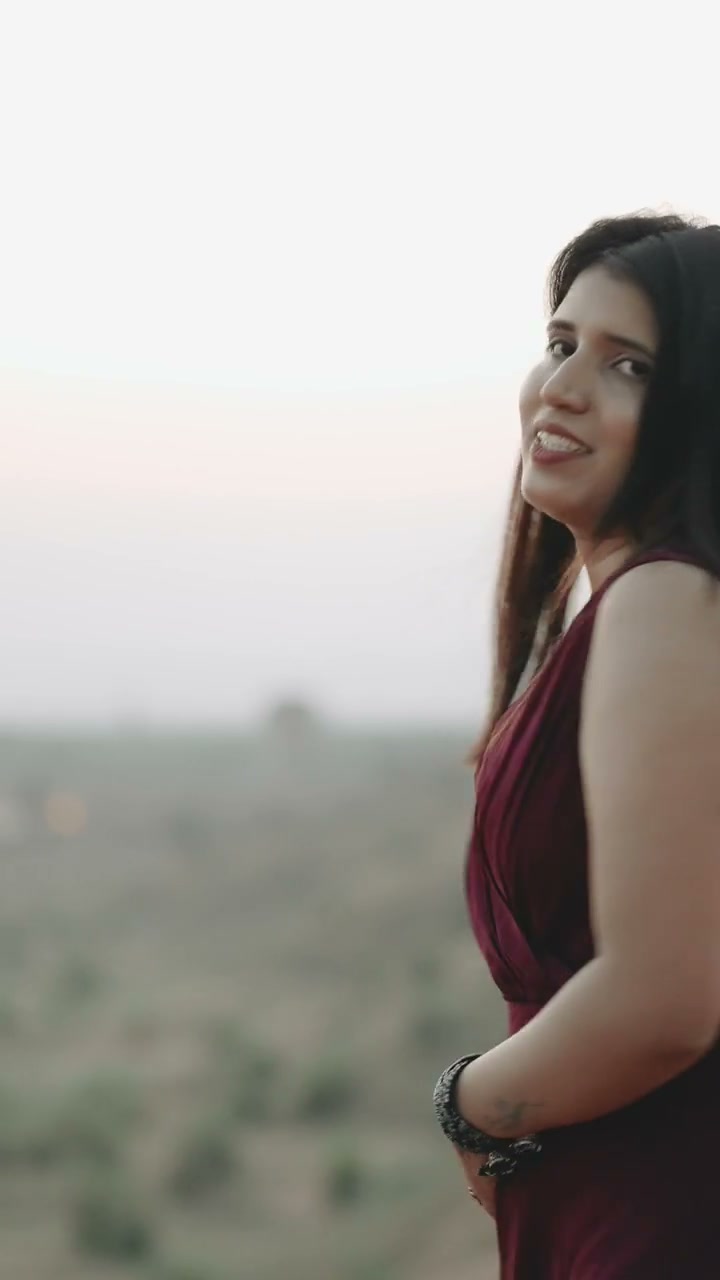 Desert dunes pre-wedding reel capturing flowing crimson gown across Thar sand ridge